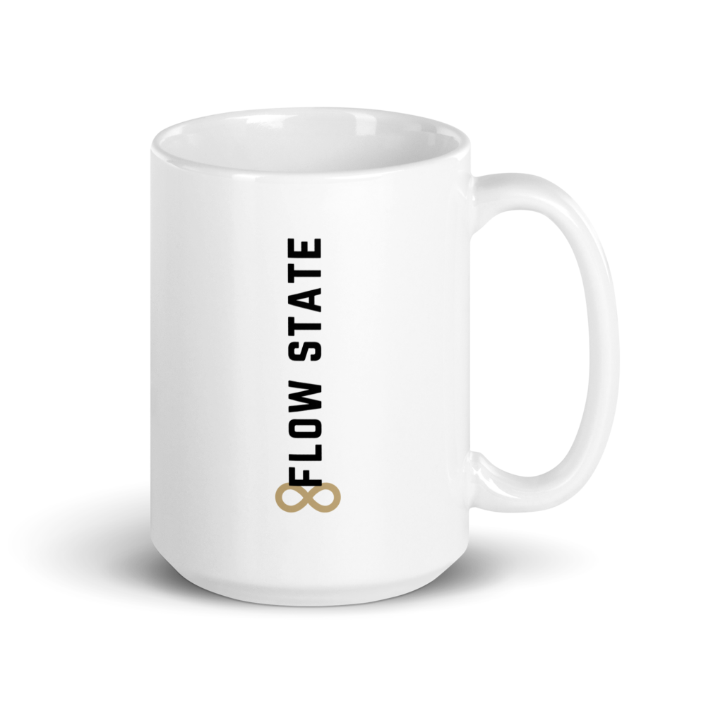 White ceramic coffee mug with vertical minimalist text and gold icon.
