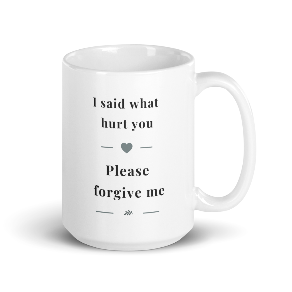 Side view of a white glossy ceramic mug with a comfortable C-handle, showing the "I said what hurt you" message in soft grey serif typography