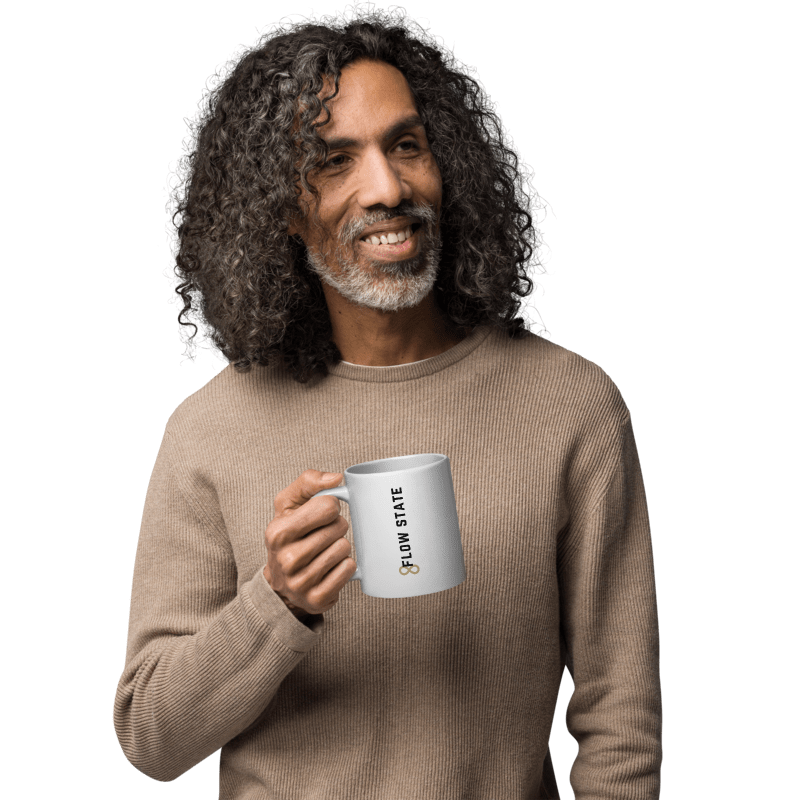White ceramic coffee mug with vertical minimalist text and gold icon.
