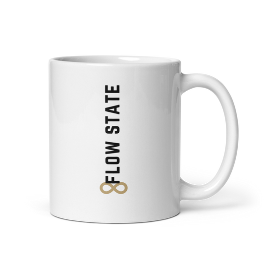 White ceramic coffee mug with vertical minimalist text and gold icon.