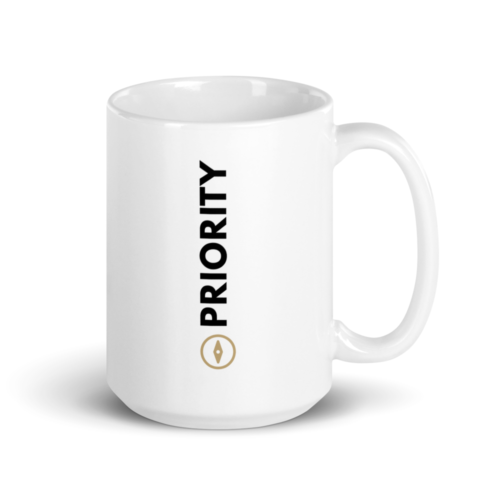 White 15 oz mug with 'PRIORITY' text and gold compass on a white background