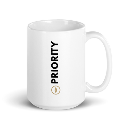 White 15 oz mug with 'PRIORITY' text and gold compass on a white background