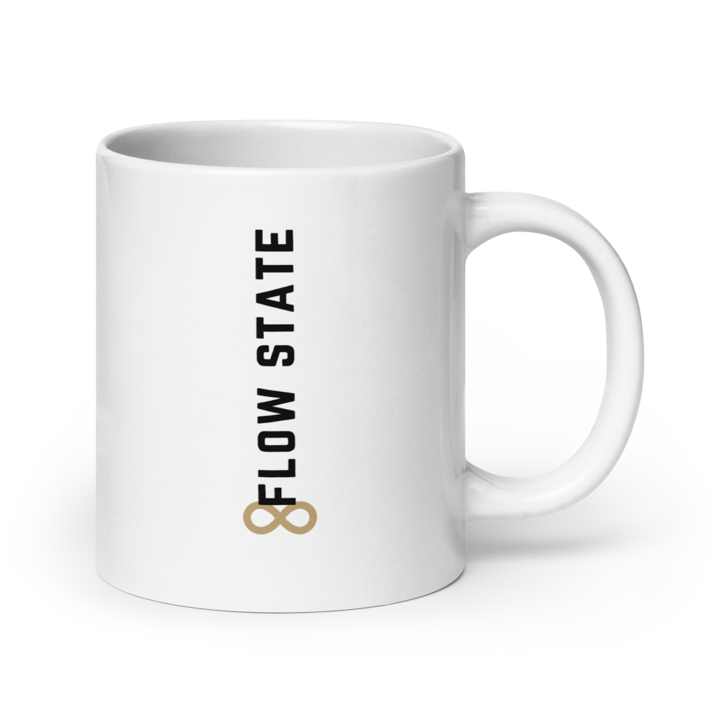 White ceramic coffee mug with vertical minimalist text and gold icon.
