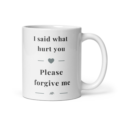 Side view of a white glossy ceramic mug with a comfortable C-handle, showing the "I said what hurt you" message in soft grey serif typography