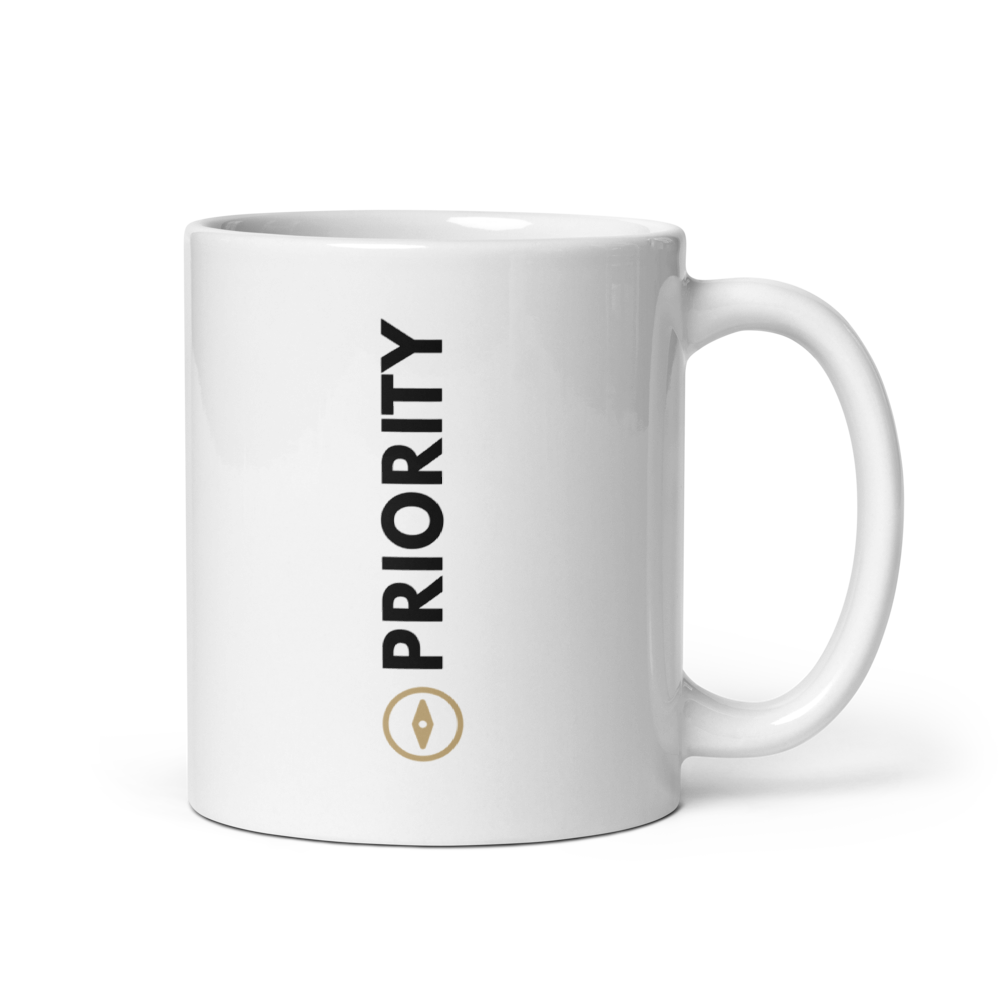 White 20 oz  mug with 'PRIORITY' text and gold compass on a white background