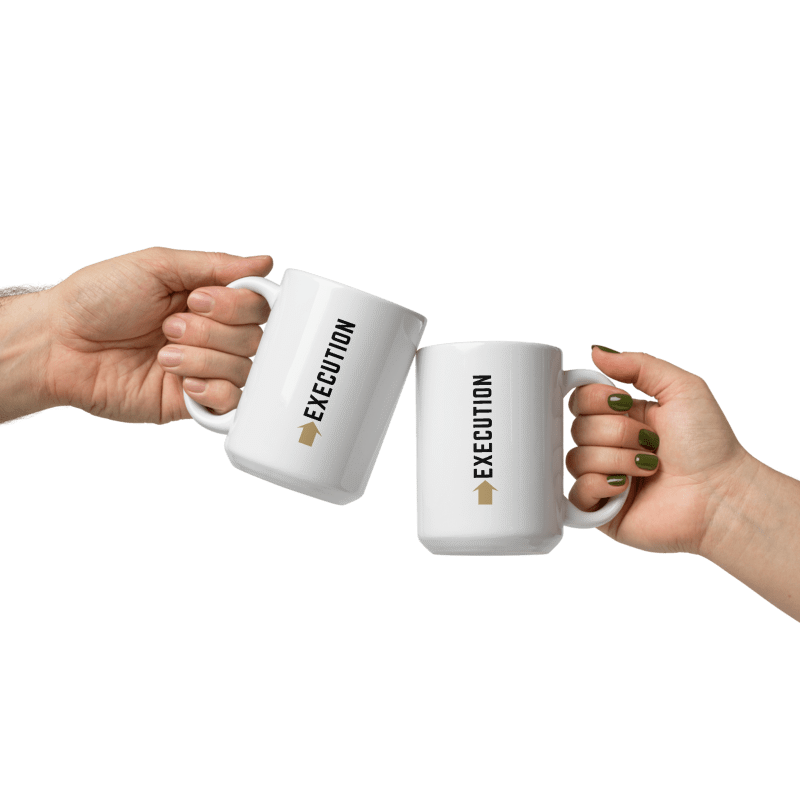 Two hands holding white mugs with "exection" text designed on a white surface